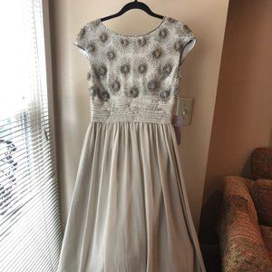 Elegant Beaded Cap Sleeved and Flowing Chiffon Skirted Gown